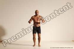 Underwear Gymnastic poses Man Black Muscular Bald Dancing Dynamic poses Academic